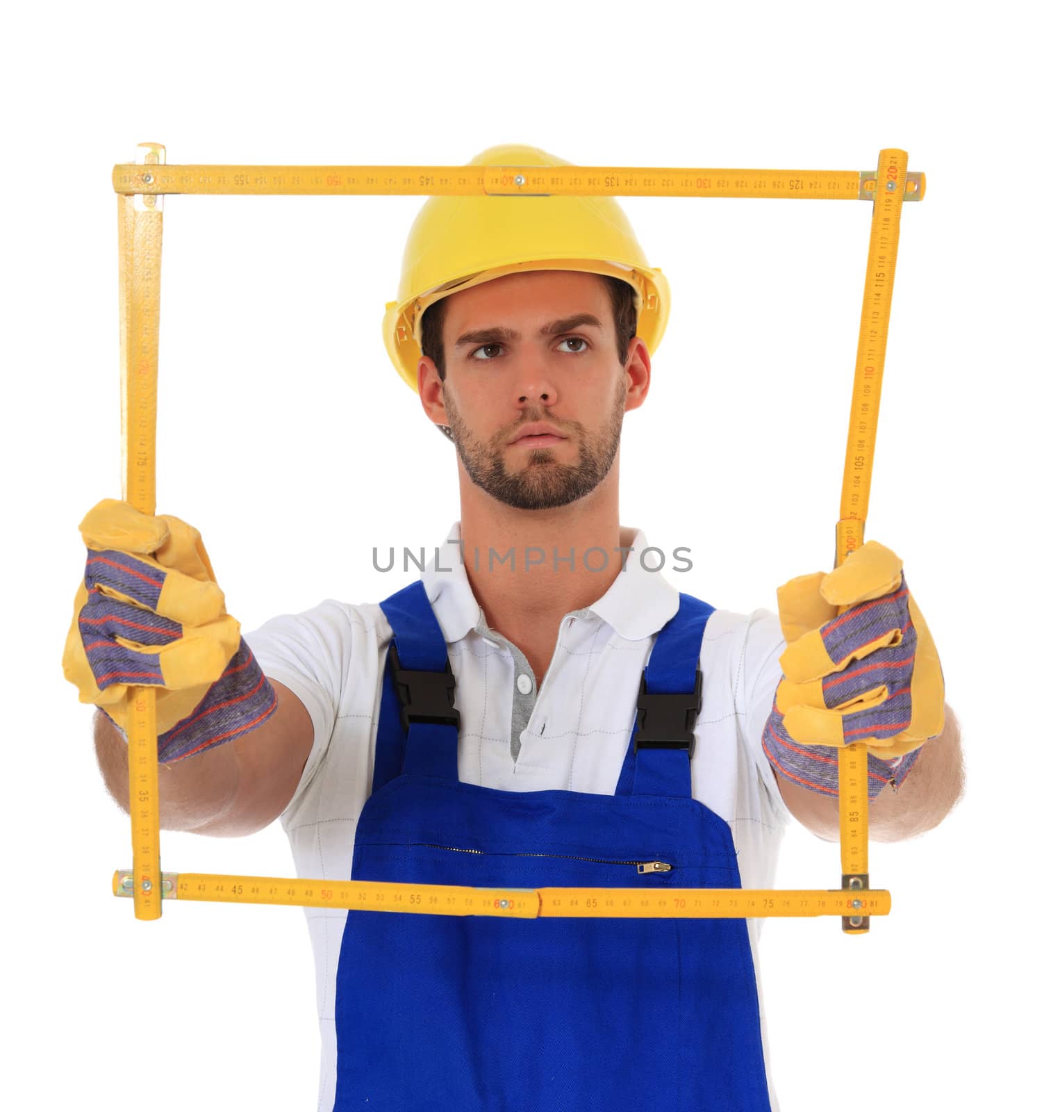 Construction worker holding folding rule. All on white background.