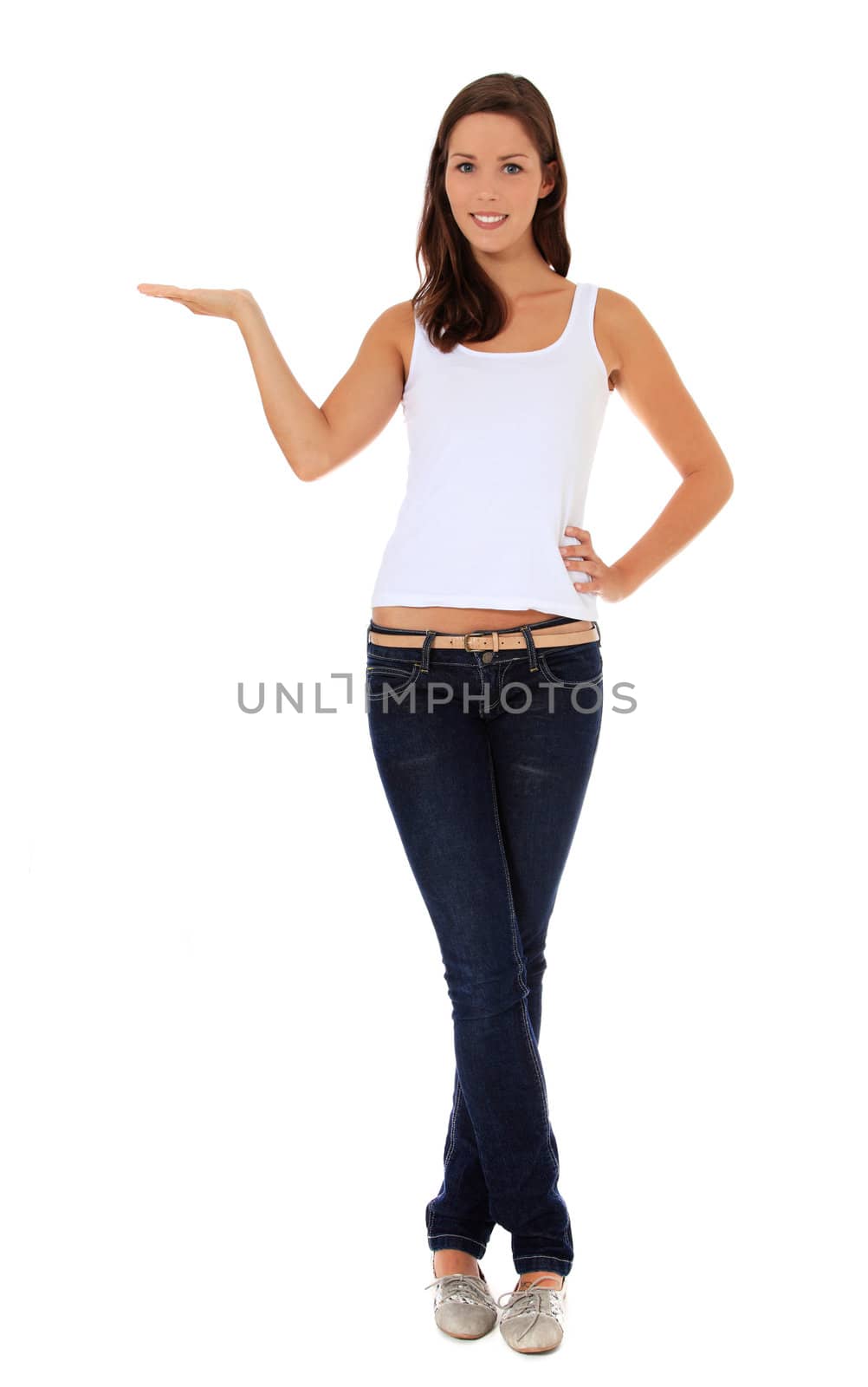Full length shot of an attractive young woman pointing to the side. All on white background.