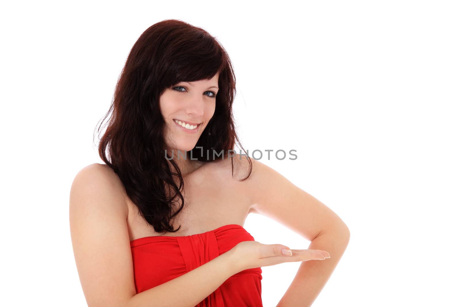 Attractive young woman pointing to the side. All on white background.