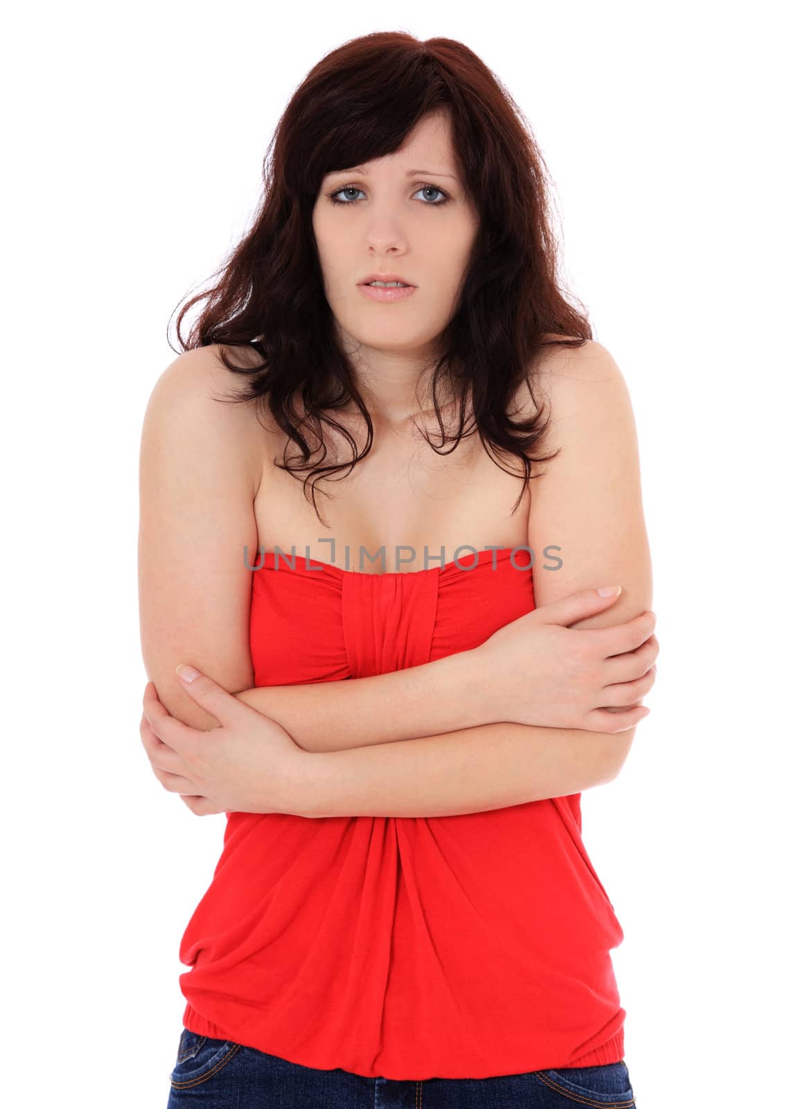 Attractive young woman freezing. All on white background.