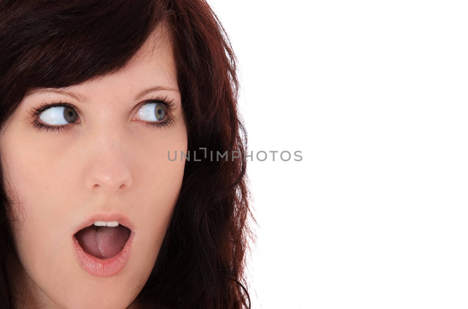 Attractive young woman looking to the side. All on white background.