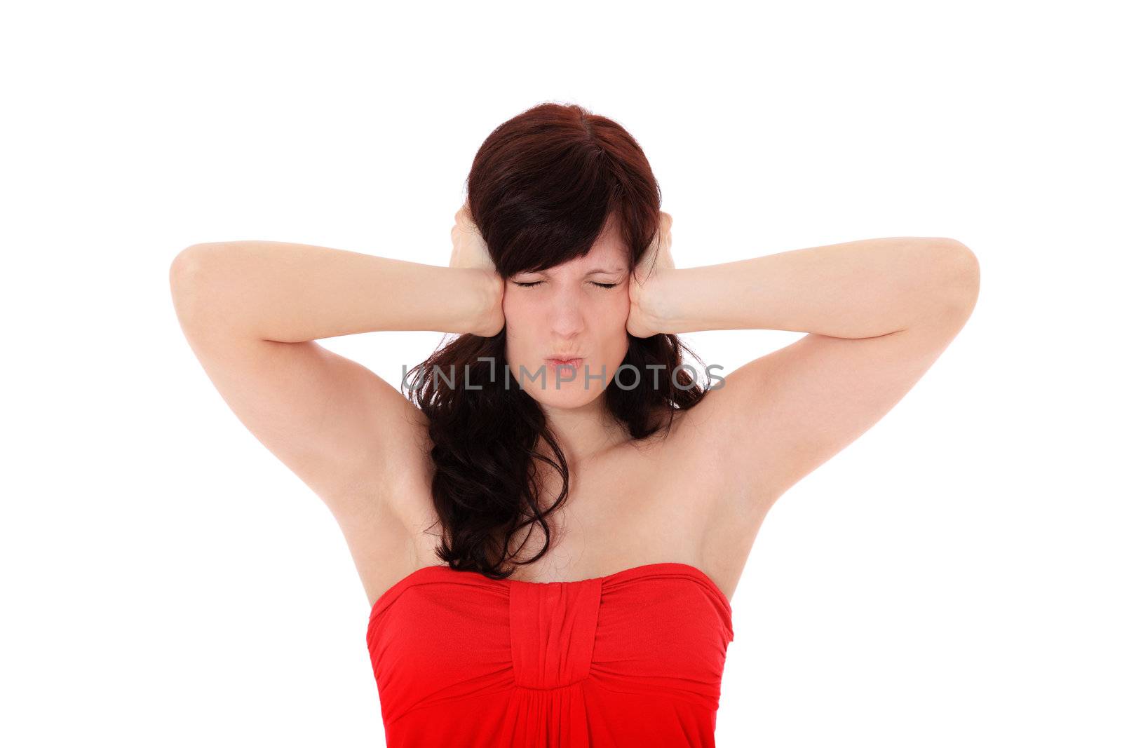 Attractive young woman keeps her ears shut. All on white background.