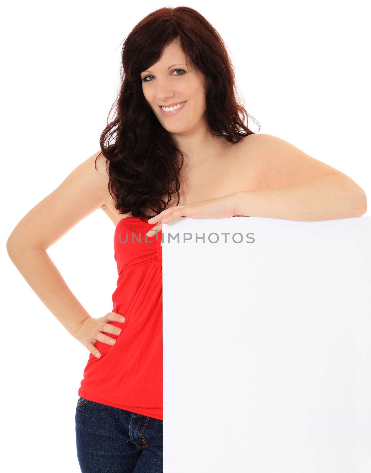 Attractive young woman standing next to blank white sign. All on white background.
