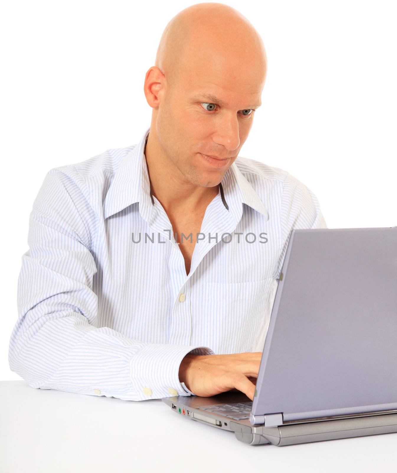 Young man working with laptop. All on white background.