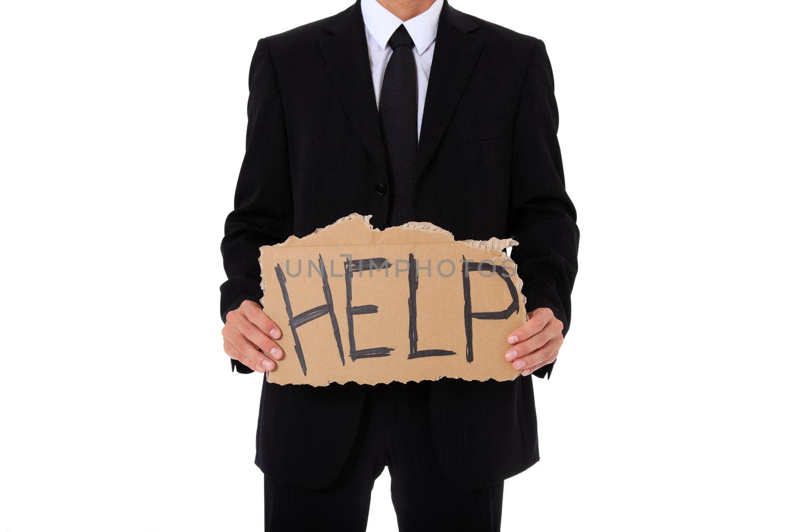 Businessman holding cardboard sign showing the term help. All on white background.