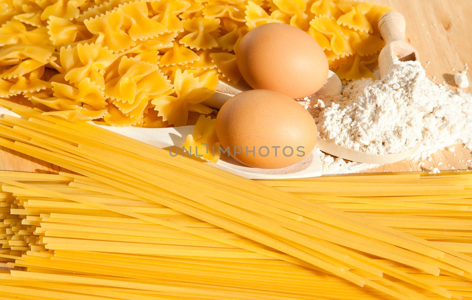 Food background: macaroni, spagetti, egg, flour