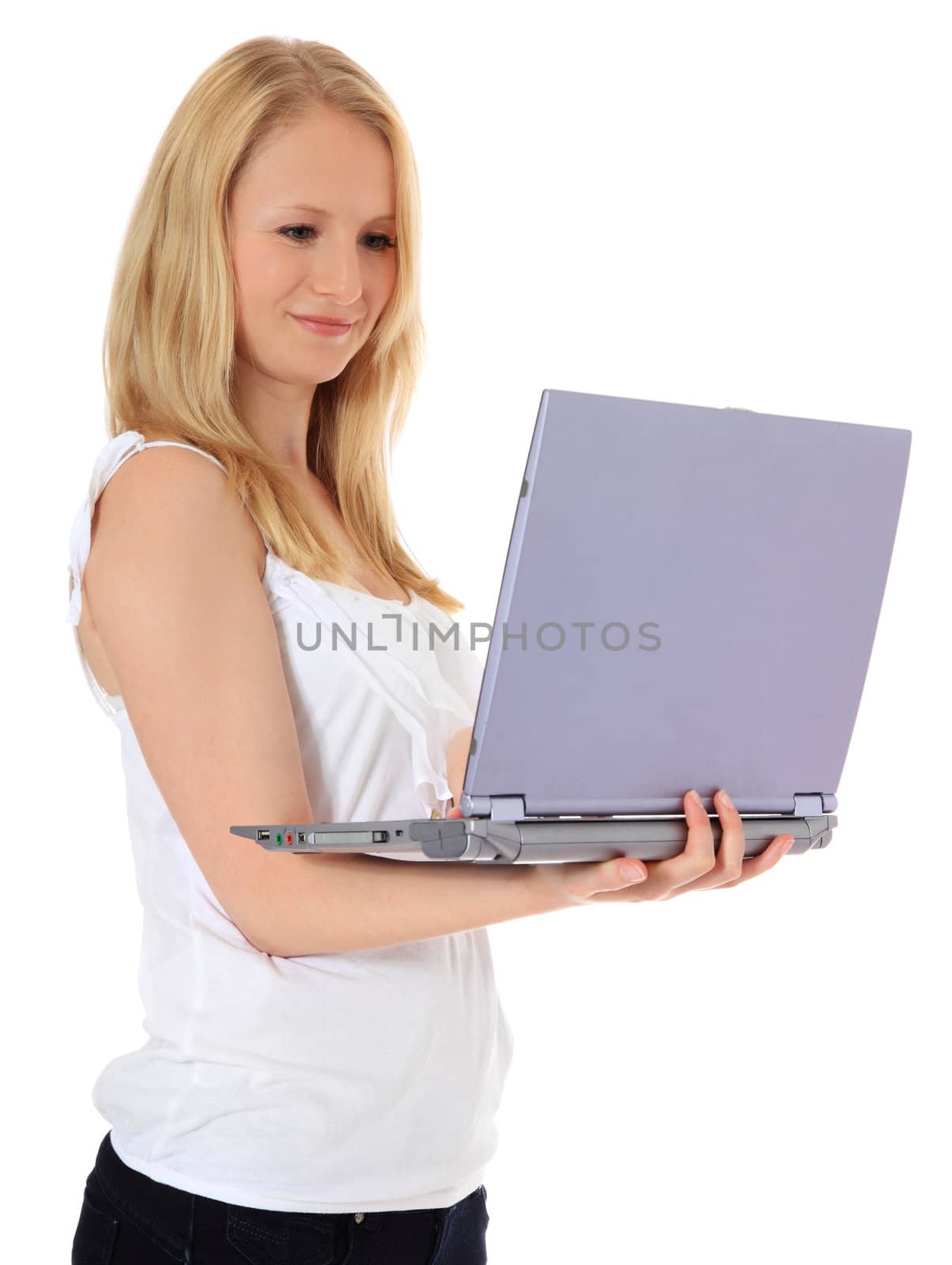 Attractive blond girl using laptop. All on white background.