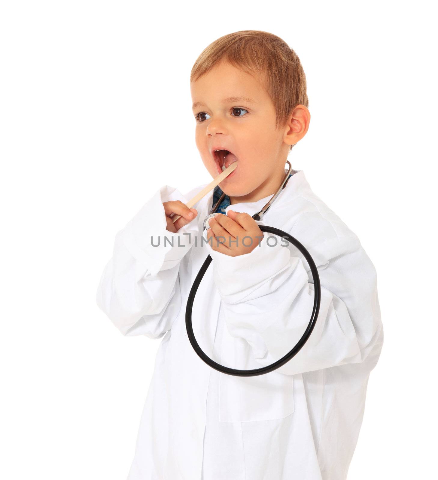 Cute caucasian boy playing doctor. All on white background.