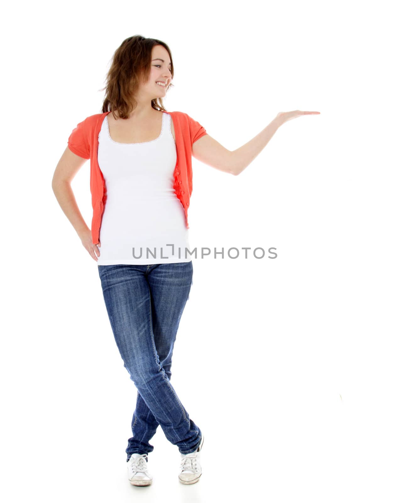 Attractive girl pointing to the side. All on white background.