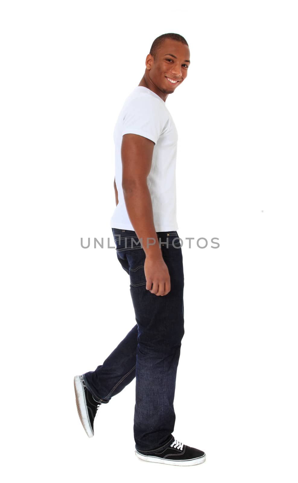 Attractive black man walking. All on white background.