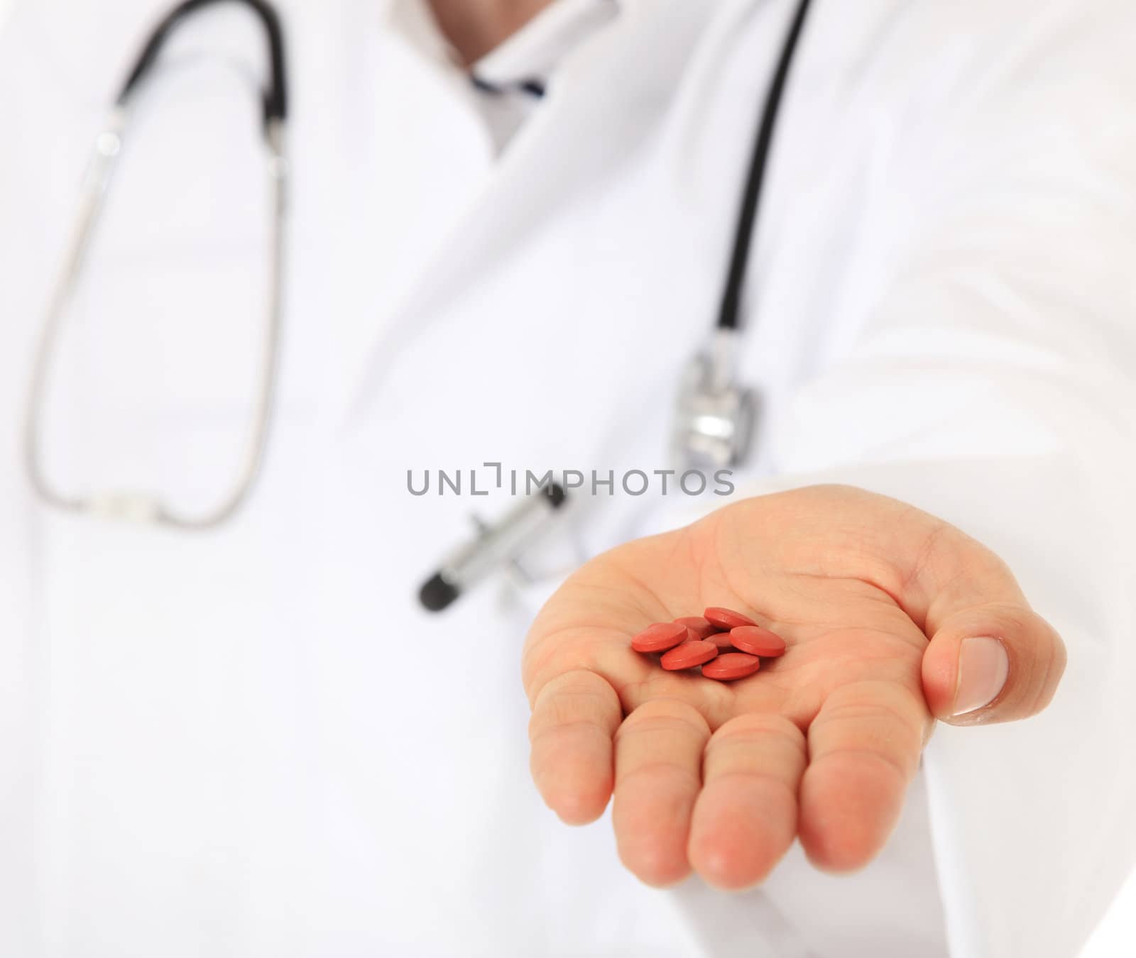 Doctor holding pharmaceuticals.