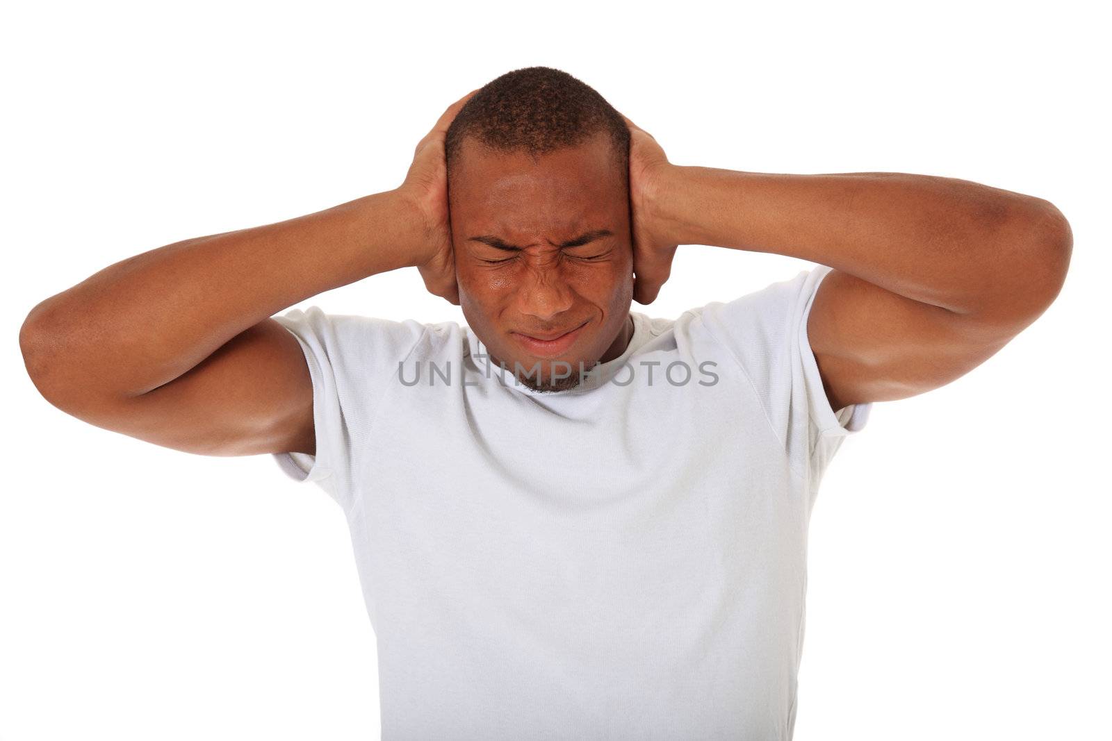 Attractive black man keeps his ears shut. All on white background.