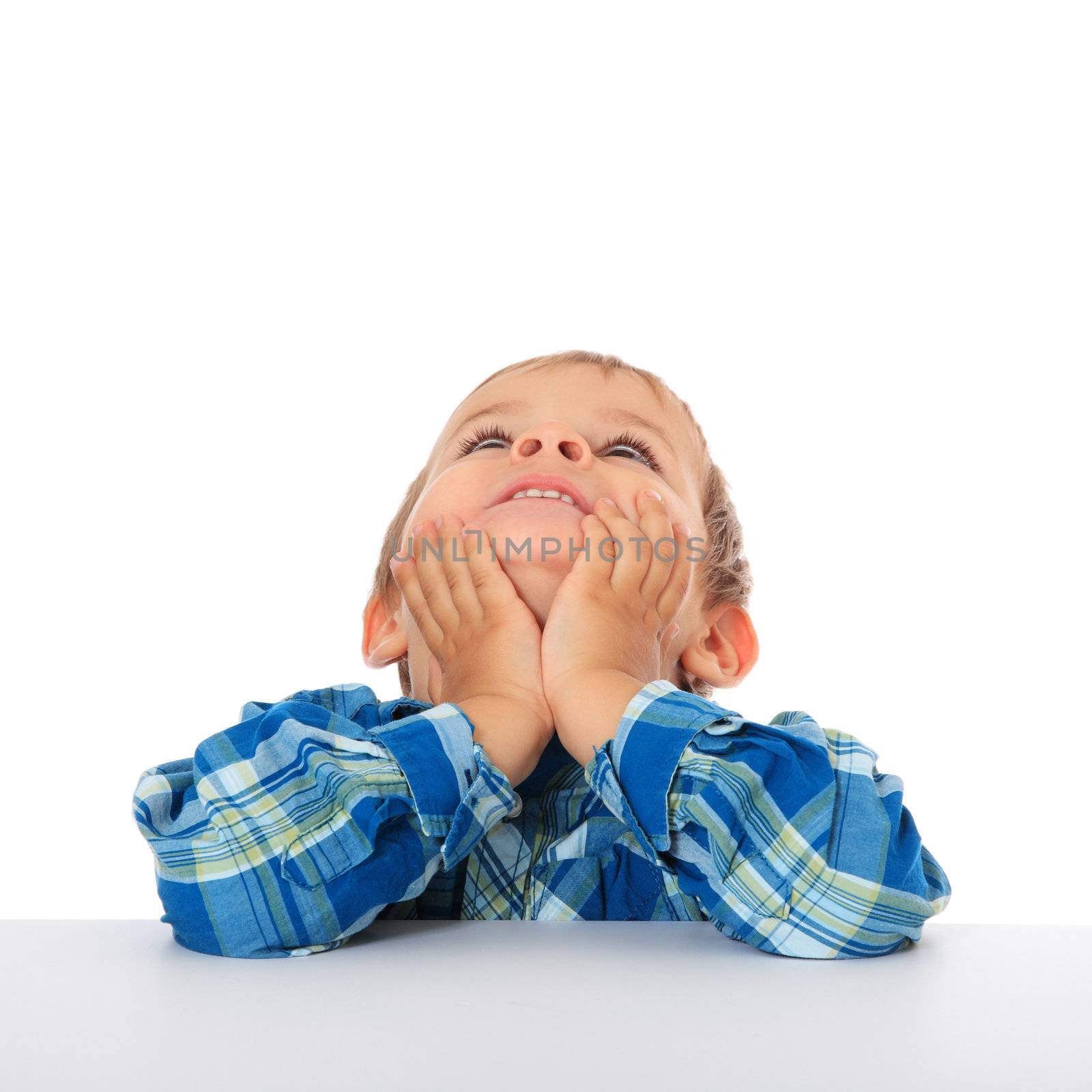 Cute caucasian boy looking up. All on white background.