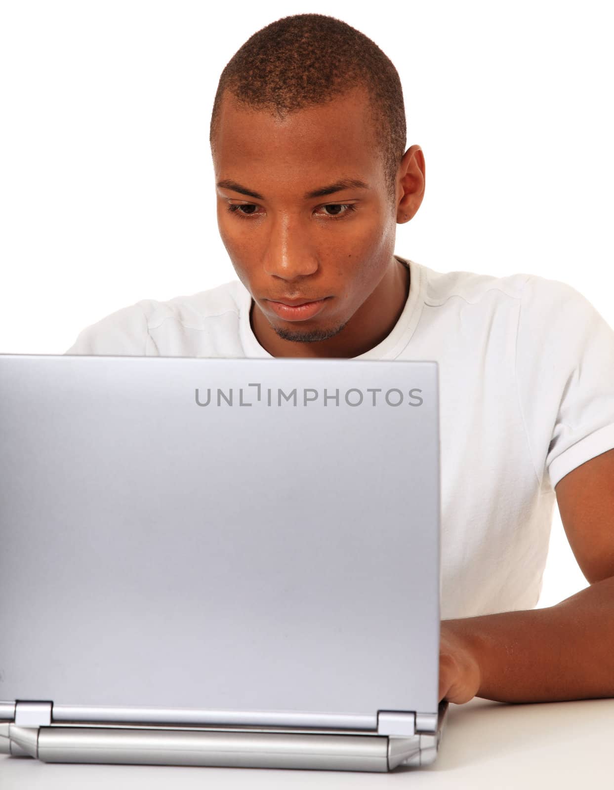 Black man using computer by kaarsten