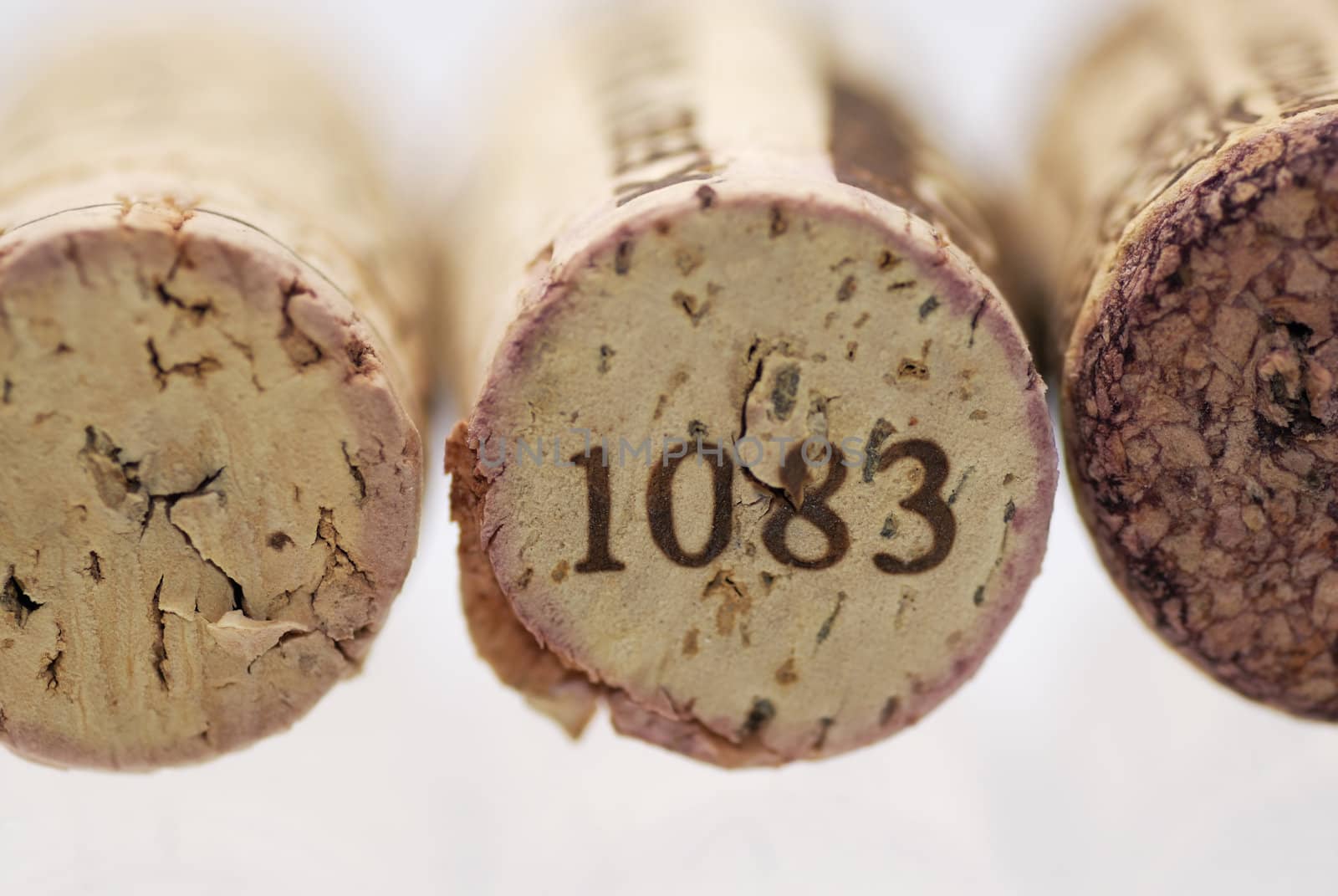 Simple studio shot of three wine corks. Focus on 1st cork, shallow DOF.