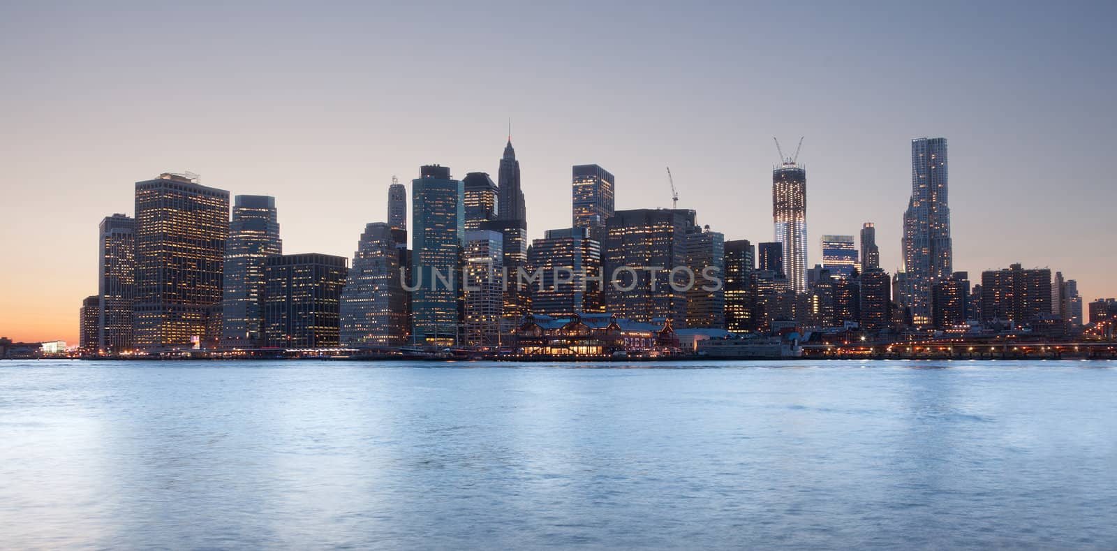 Lower Manhattan at sunset taken from side of Brooklyn Bridge