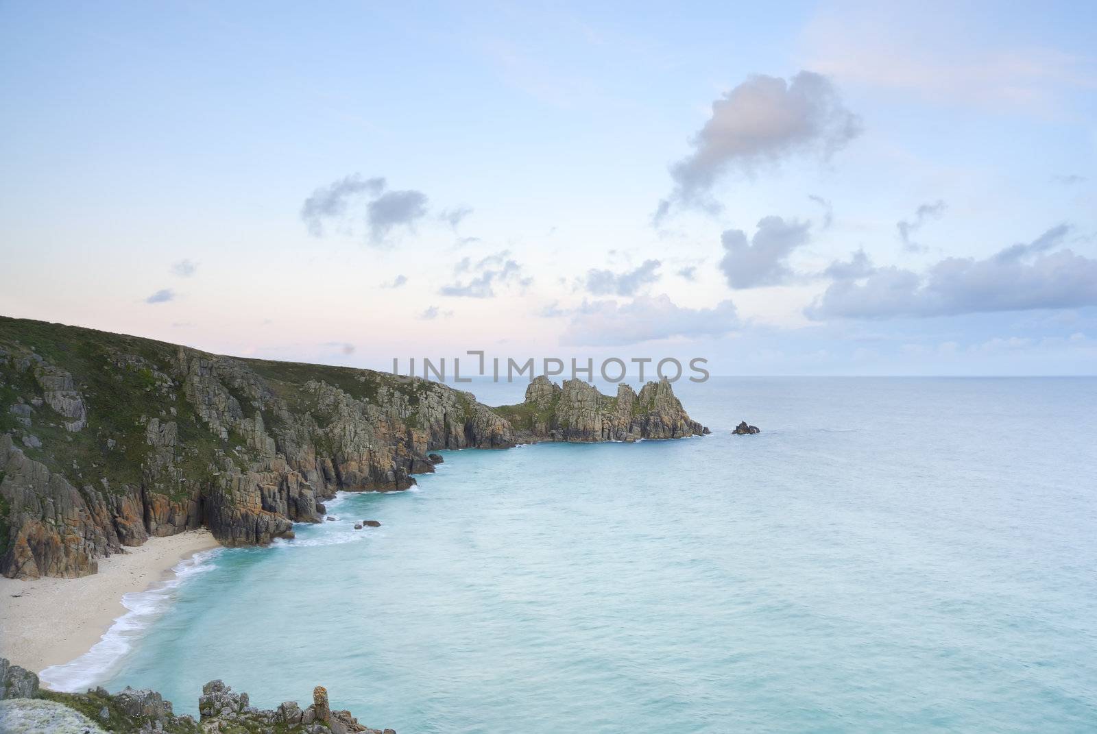 Pedn vounder beach, one of Cornwall's best beaches with stunning cliffs of Treryn Dinas, crystal clear water and a beautiful sandy beach.
 
 On a spring low tide one can walk to Pedn Vounder from neighbouring Porthcurno beach but be warned, as the tide comes in you will not only find yourself cut off but facing a climb up the steep cliff "path"
 
 The headland to the east of the beach is the location of the famous Logan Rock, a rectangular block of granite which weighs about 70 tons, and which can be rocked back and forth by one person.
 
 Pedn Vounder is an unoffical naturist beach