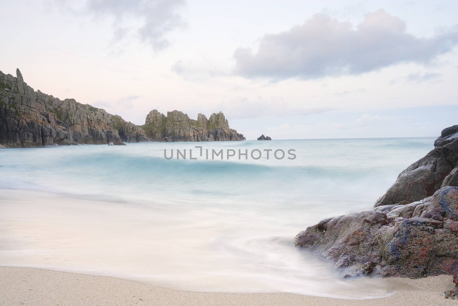 Pedn vounder beach, one of Cornwall's best beaches with stunning cliffs of Treryn Dinas, crystal clear water and a beautiful sandy beach.
 
 On a spring low tide one can walk to Pedn Vounder from neighbouring Porthcurno beach but be warned, as the tide comes in you will not only find yourself cut off but facing a climb up the steep cliff "path"
 
 The headland to the east of the beach is the location of the famous Logan Rock, a rectangular block of granite which weighs about 70 tons, and which can be rocked back and forth by one person.
 
 Pedn Vounder is an unoffical naturist beach