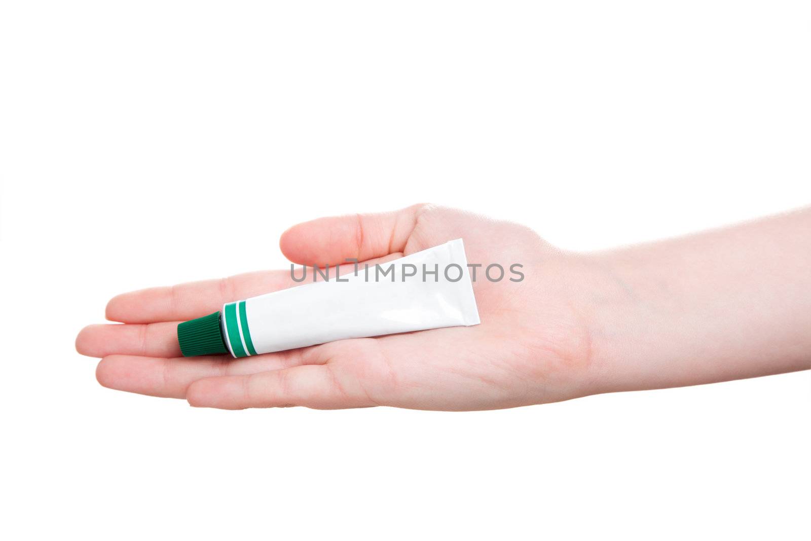 tube with ointment in hand, isolated on a white background 
