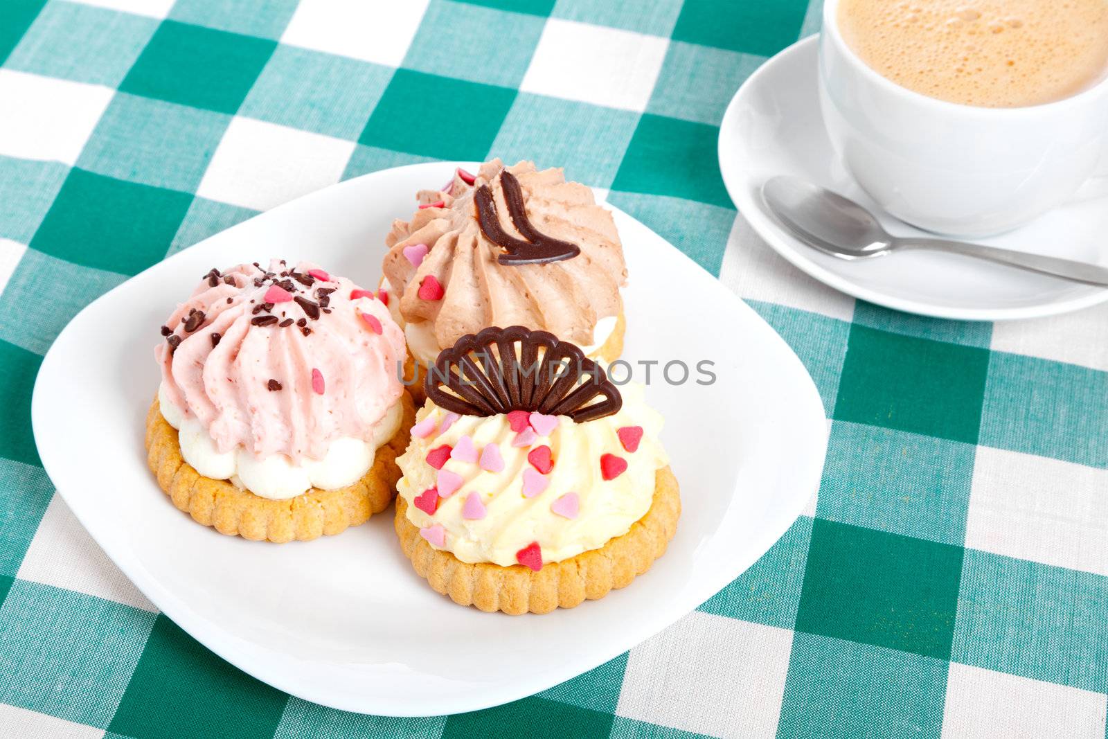 three cake on tablecloth. Coffee cup by motorolka