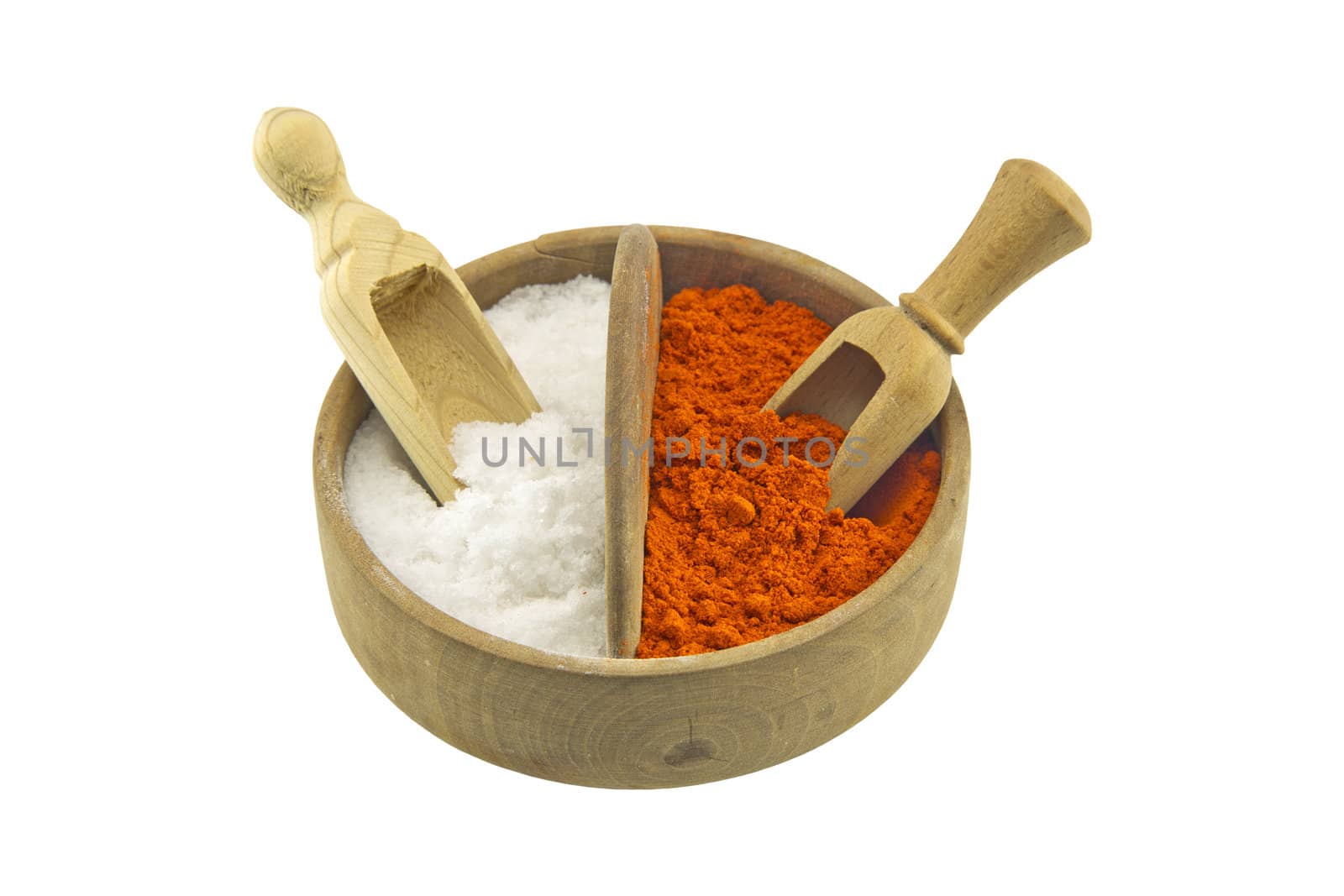 Salt and paprika in a wooden salt box isolated on white