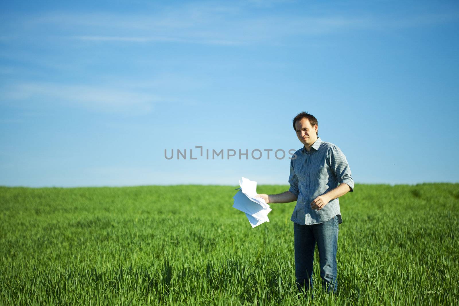 man throws the paper in the field by jannyjus