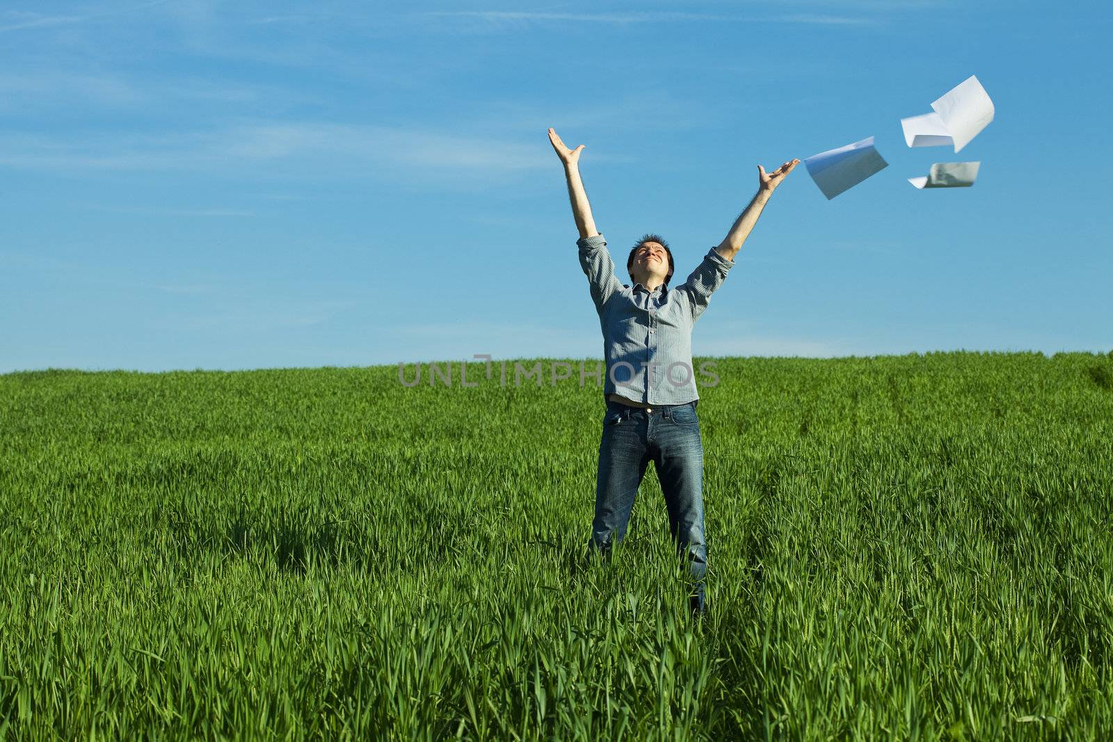 man throws the paper in the field by jannyjus