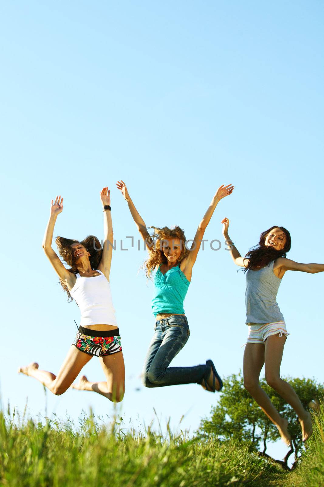 fun smile girlfriends jump to sky