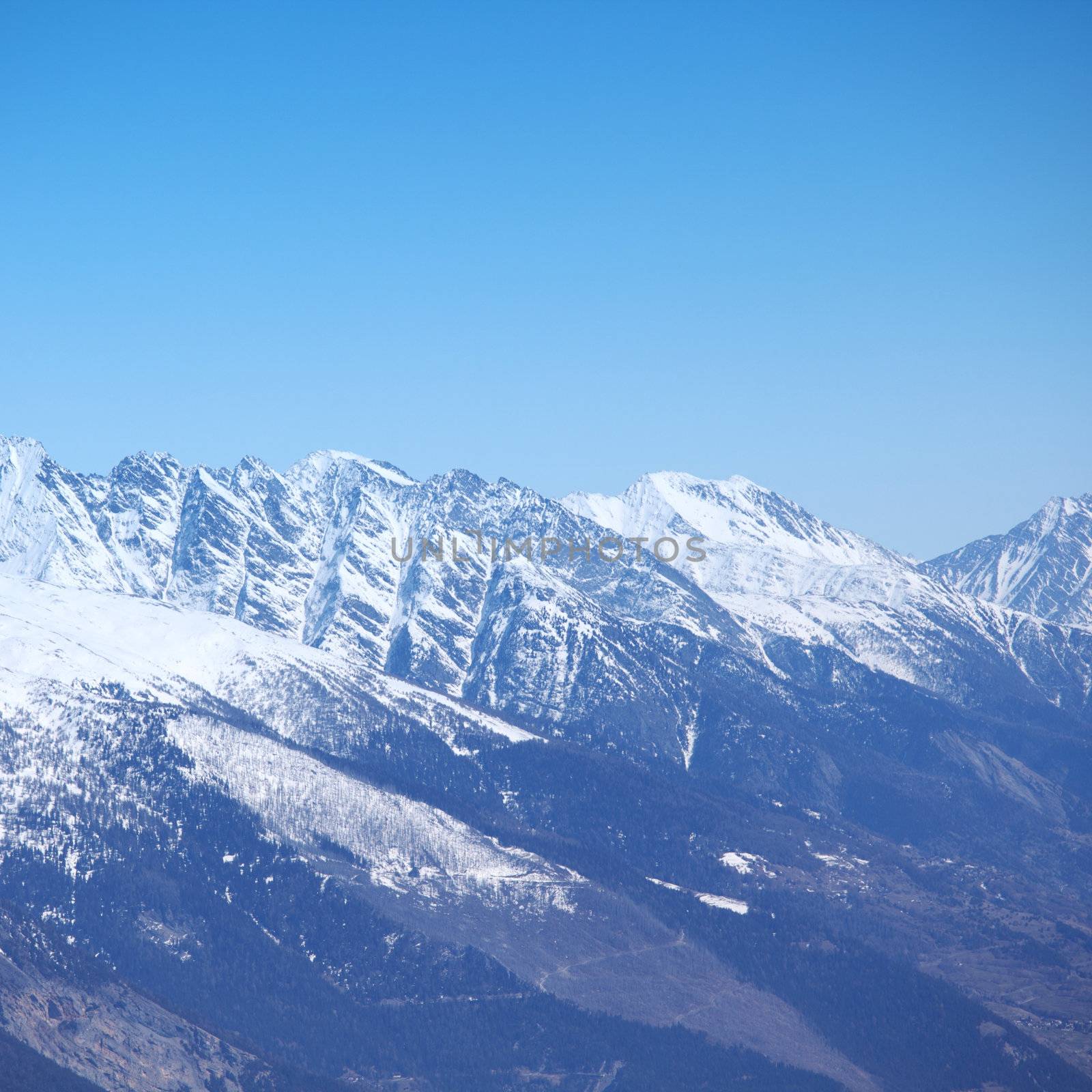 top of mountains sun in blue sky