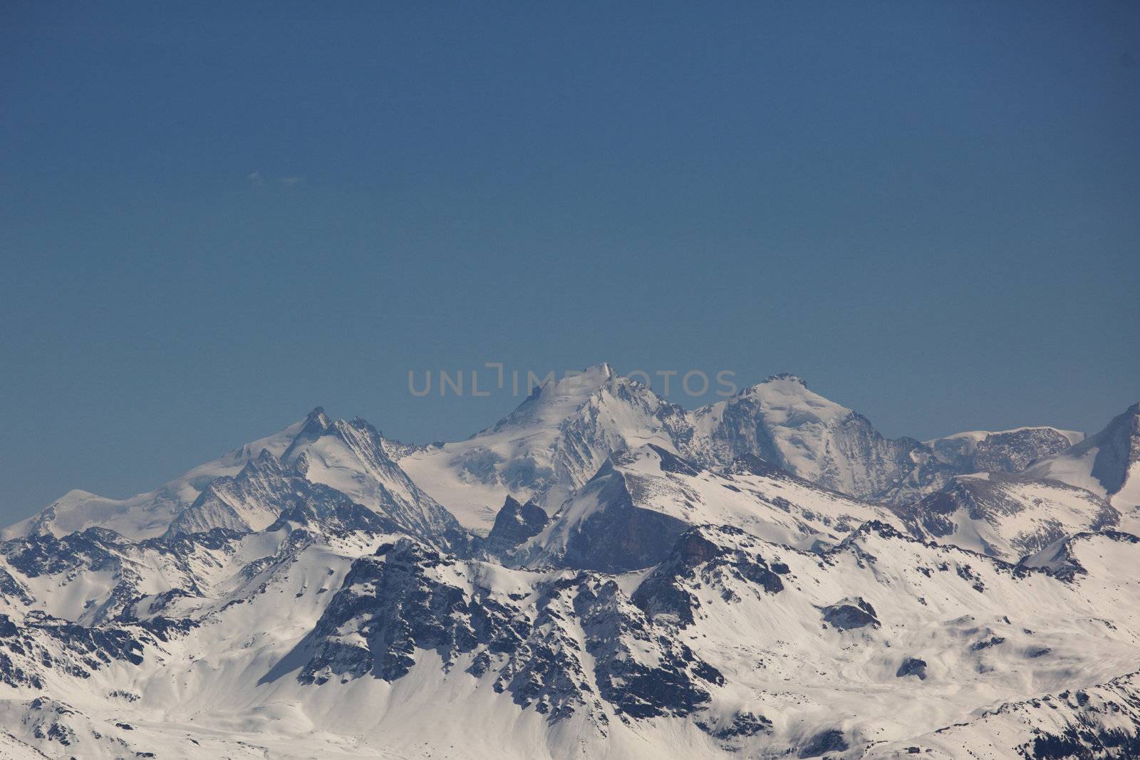 top of mountains in blue sky