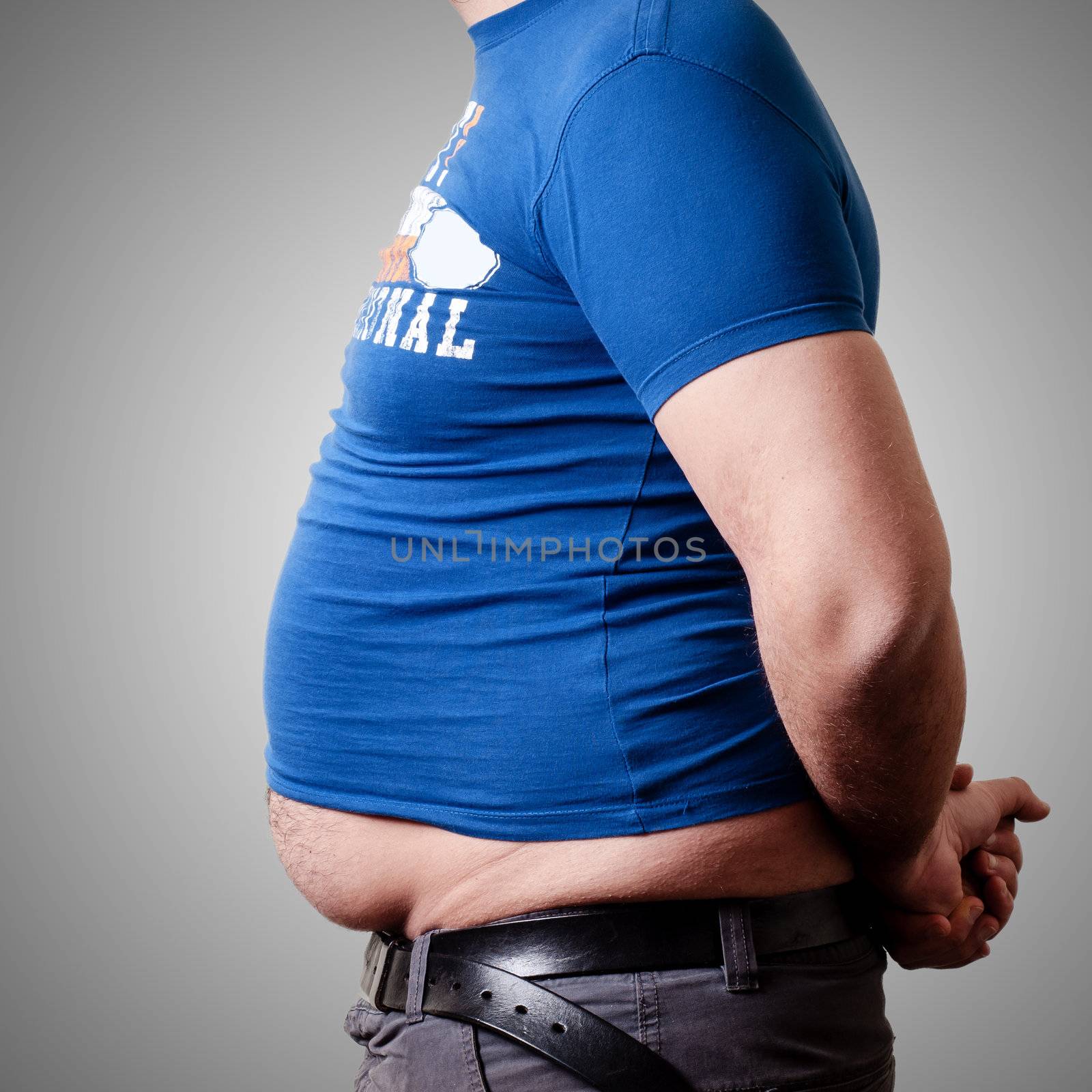 belly fat man on gray background