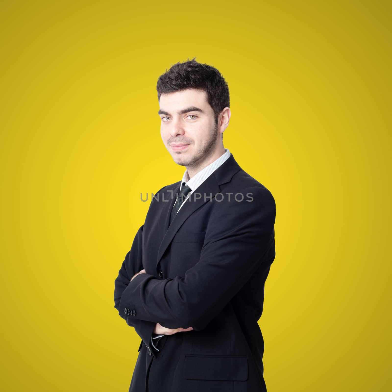 portrait of elegant businessman on yellow background
