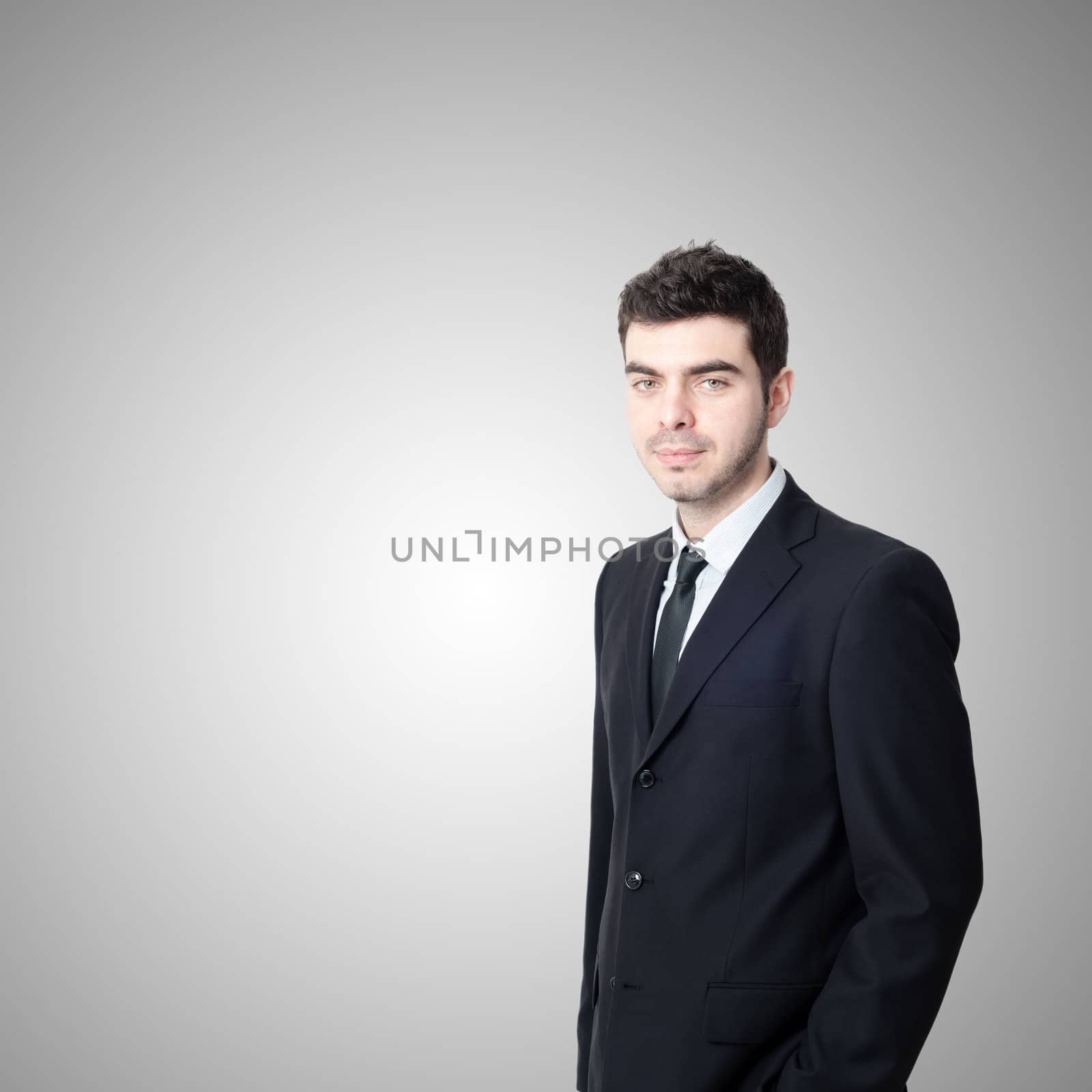 portrait of elegant businessman on gray background