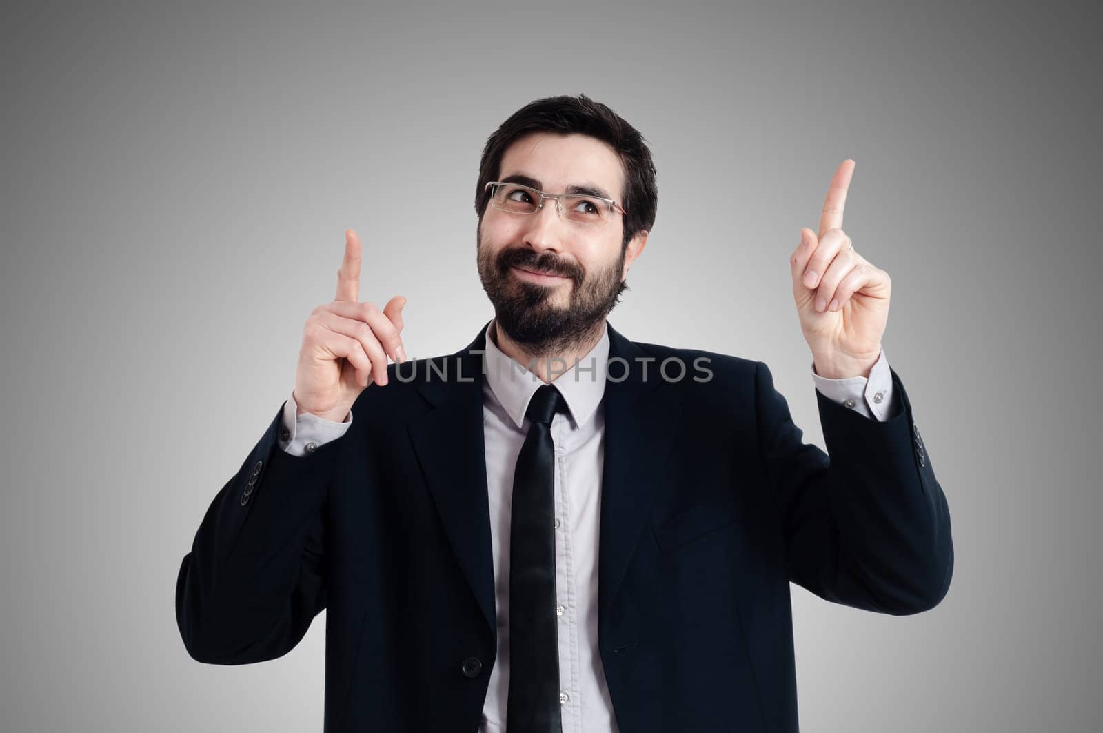 success business man pointing on gray background