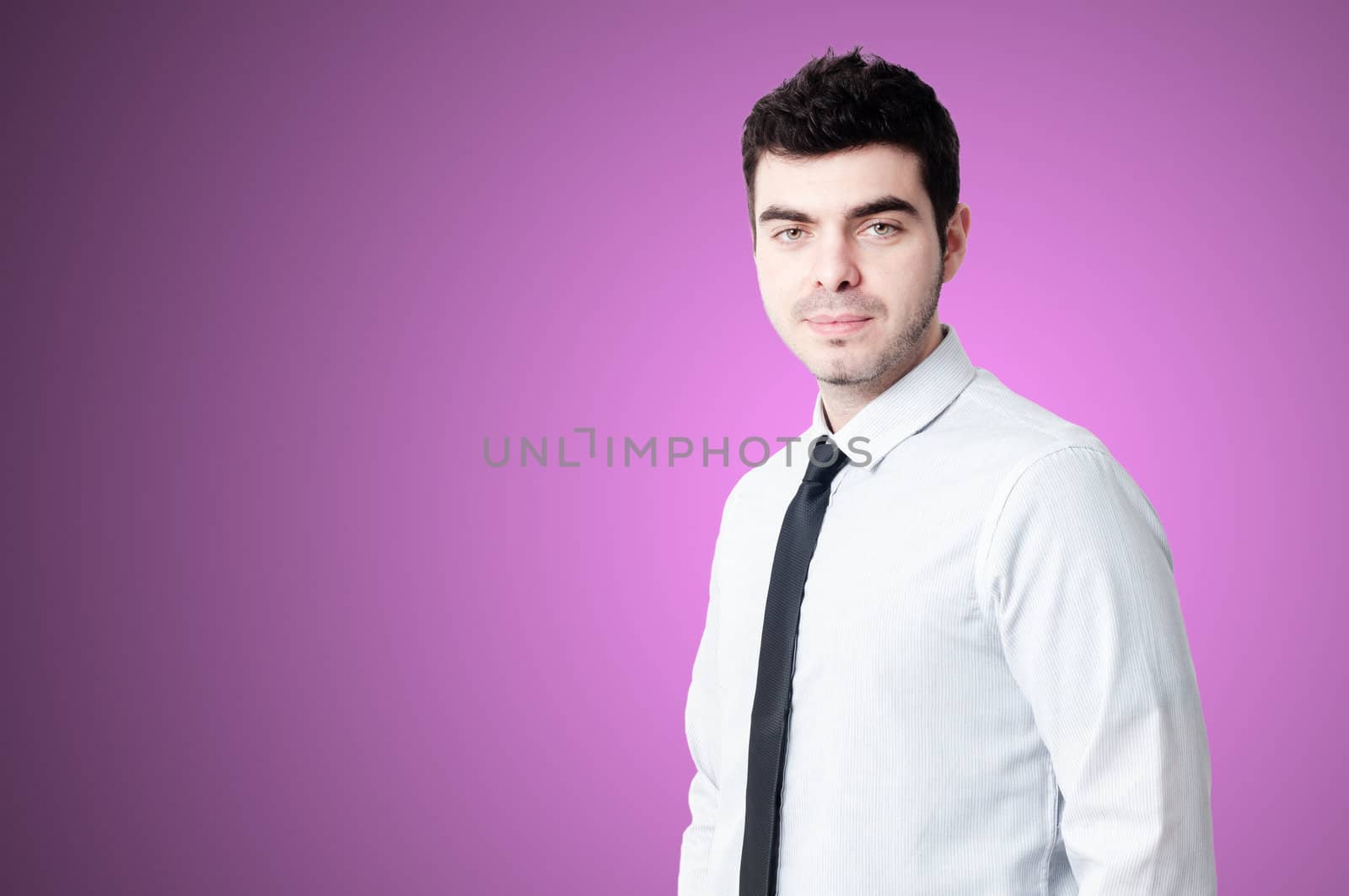 portrait of elegant businessman on pink background