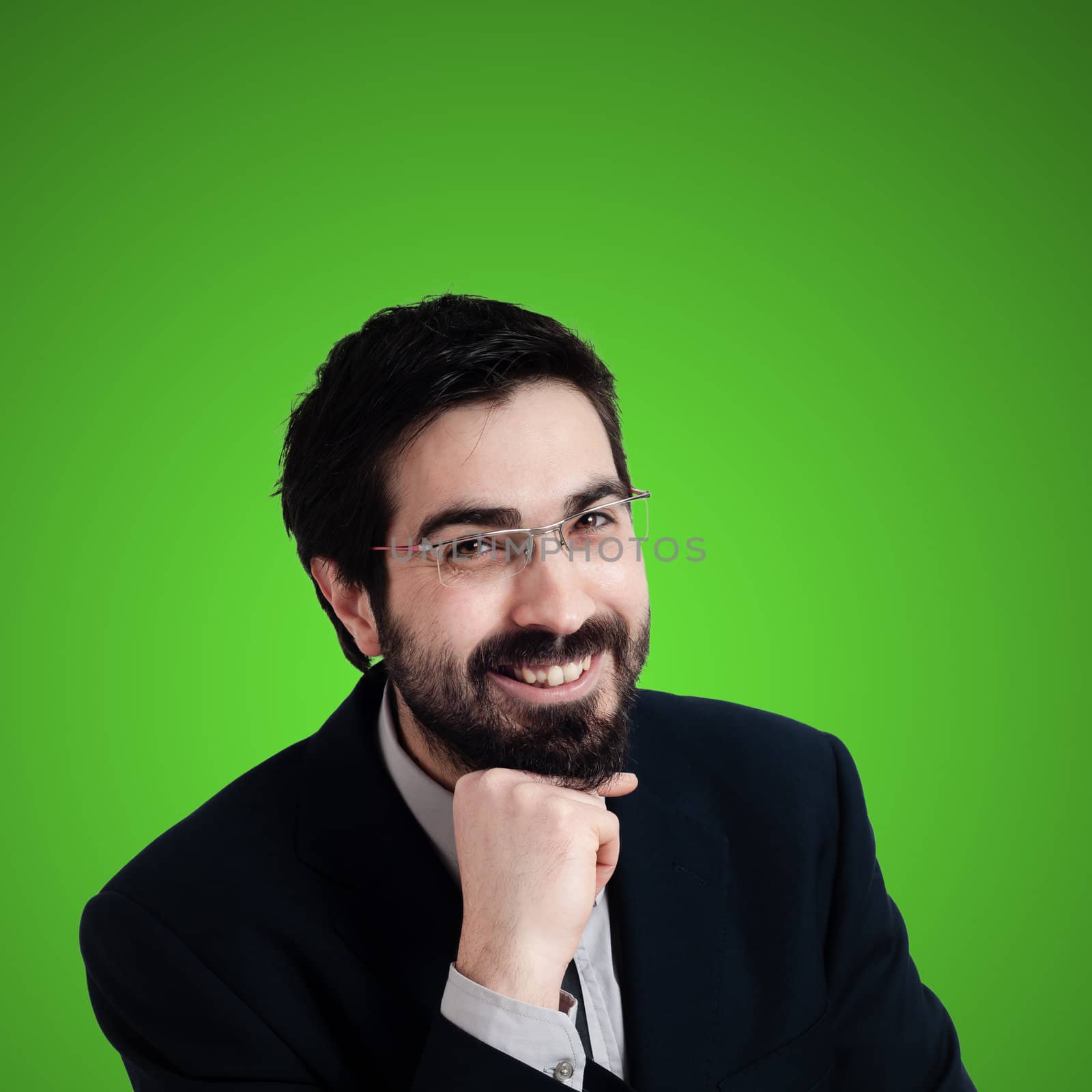 smiling businessman on green background
