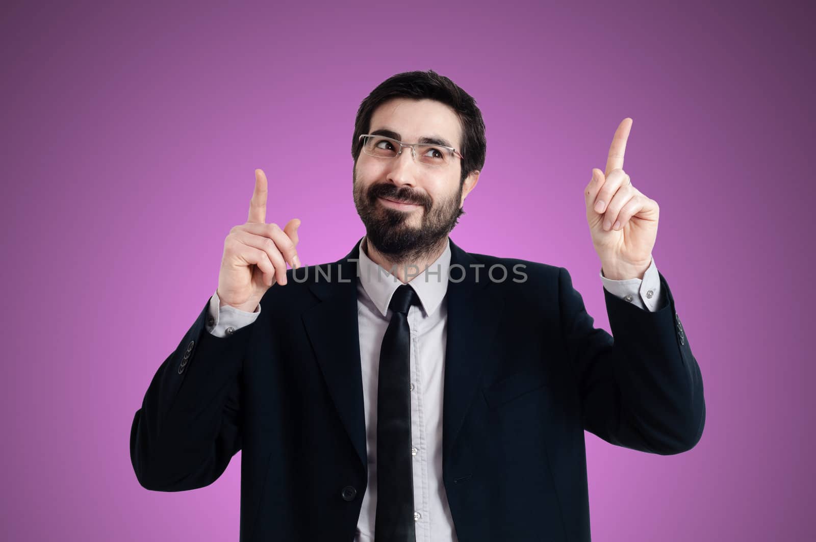 success business man pointing on pink background