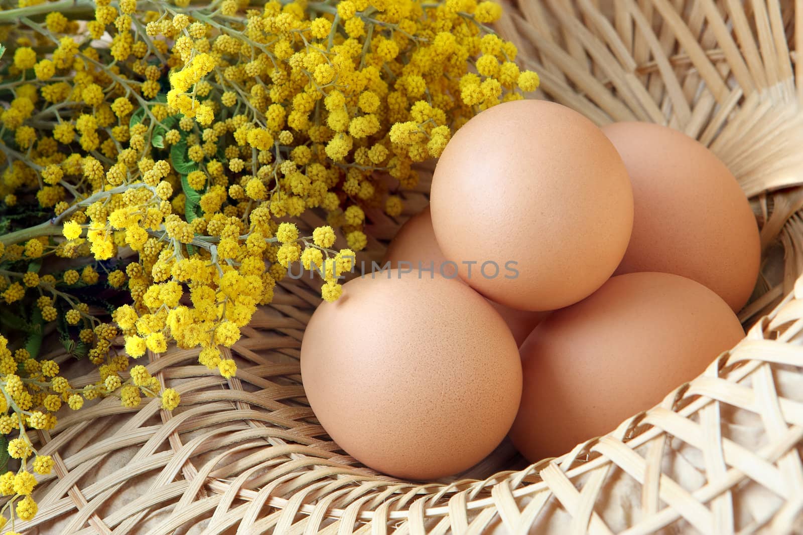 A wicker basket full of brown free range eggs