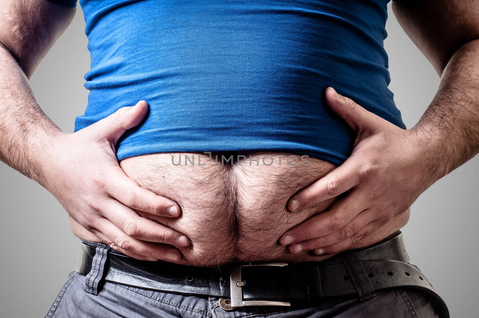 belly fat man on gray background