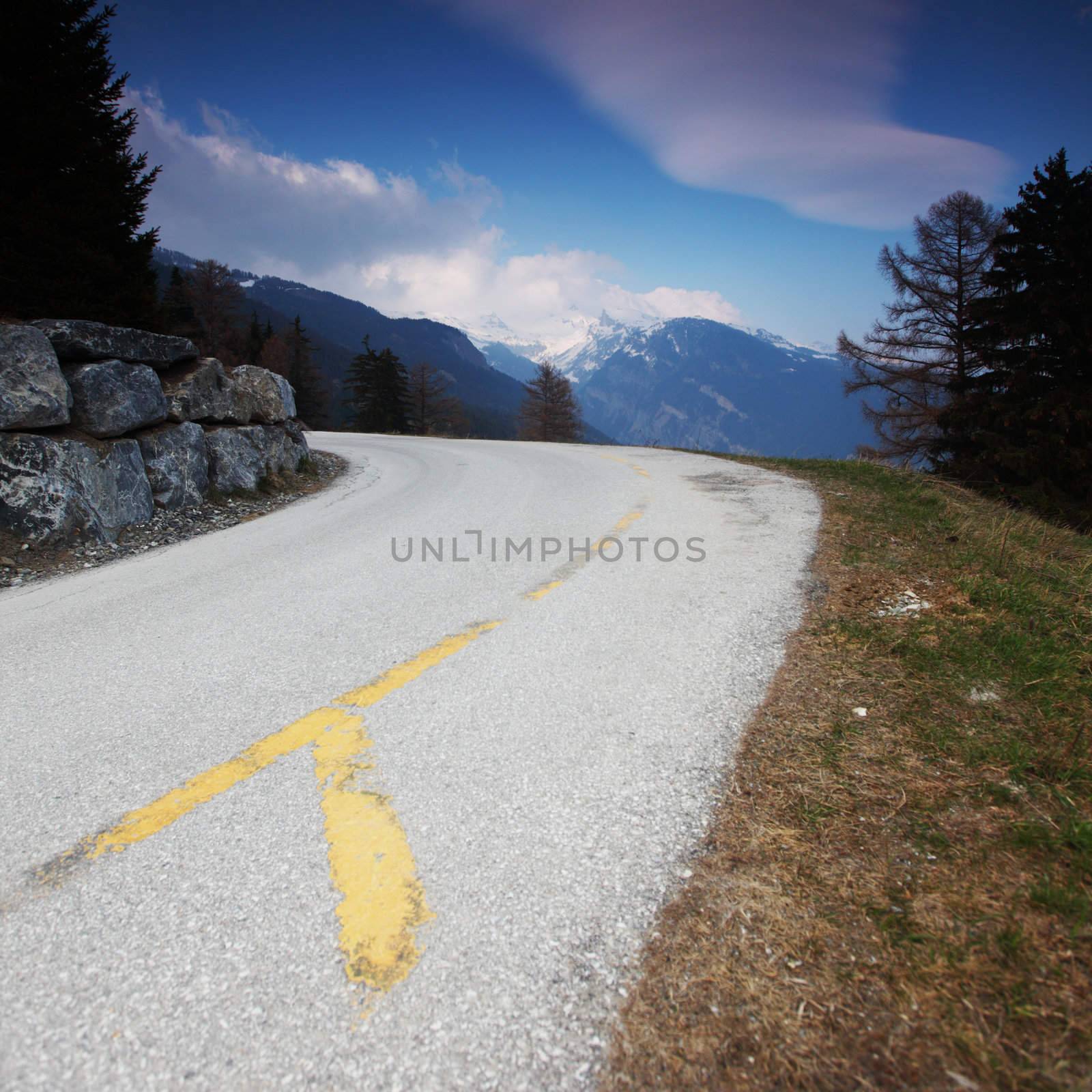 mountain road under blue sky