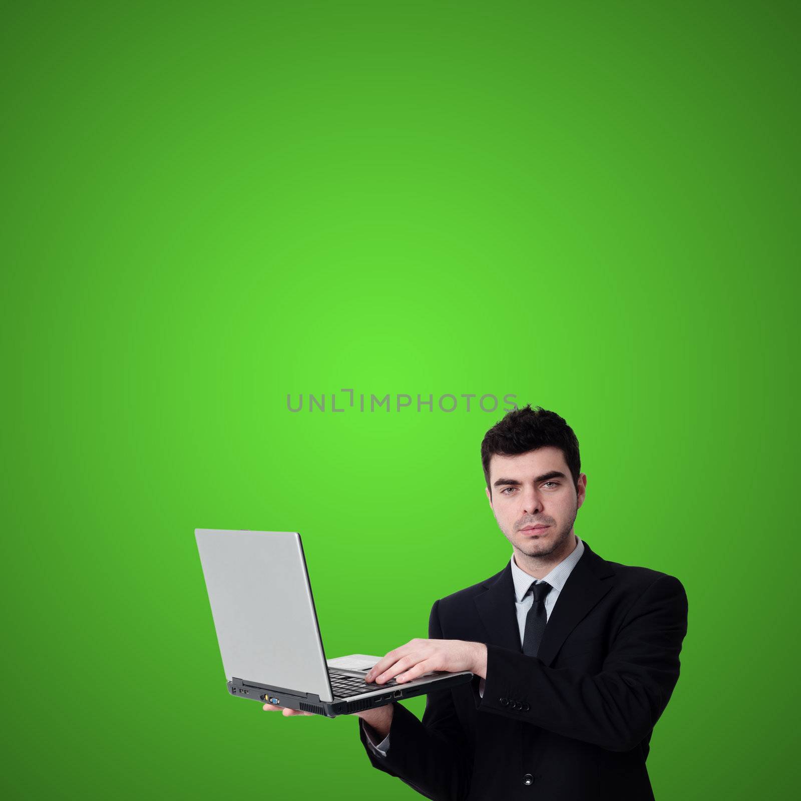 business man with notebook on green background