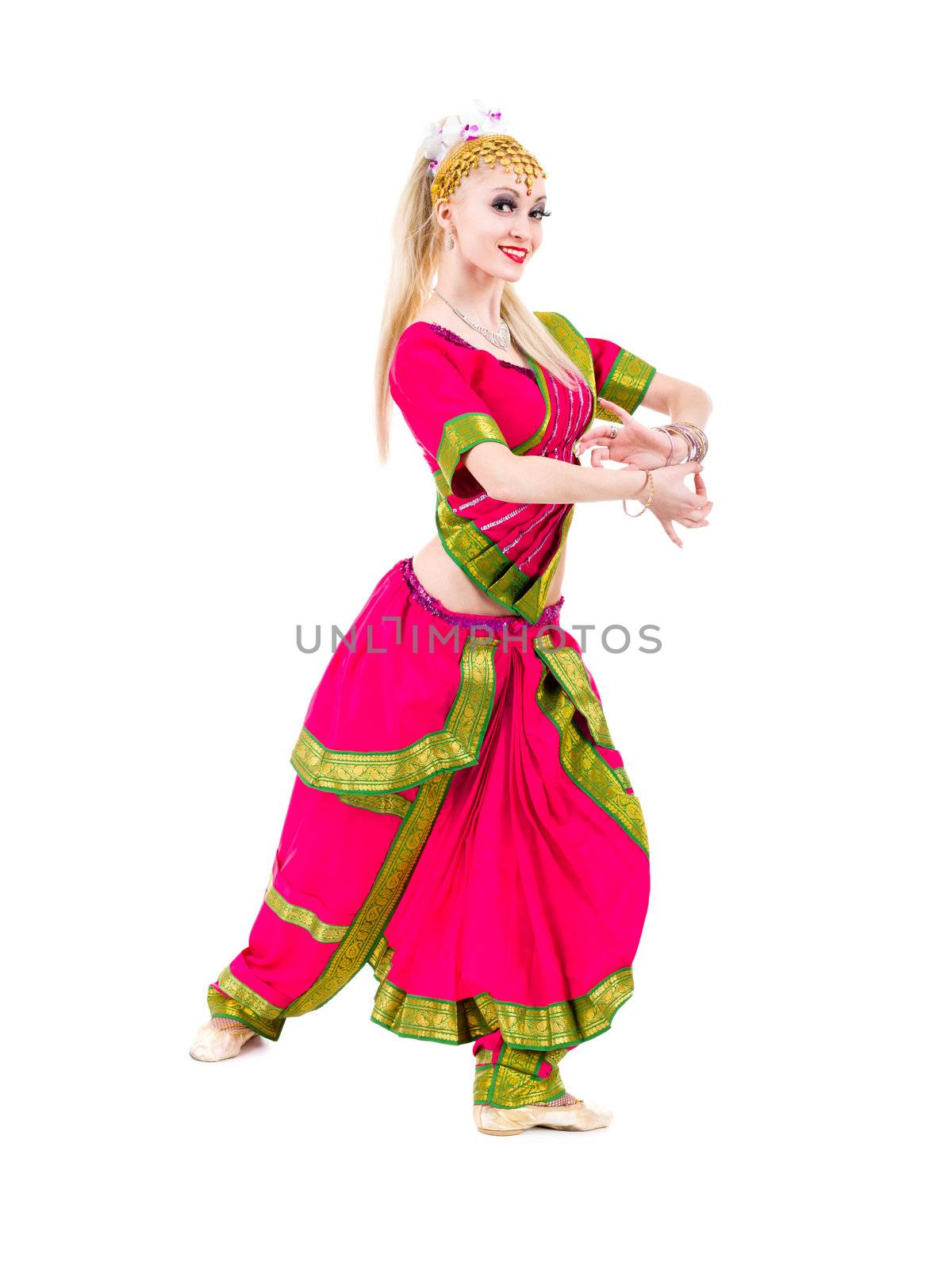 full length portrait of indian woman dancing in studio.  Isolated on white background.