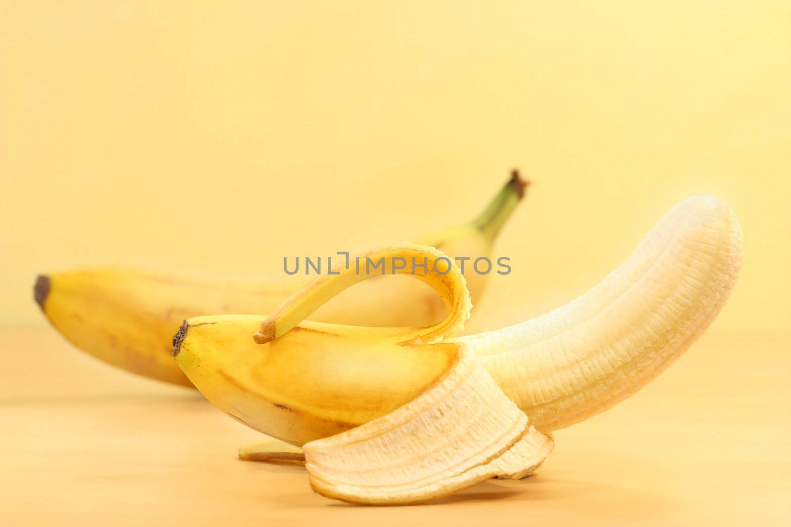 Bananas with banana peel on counter