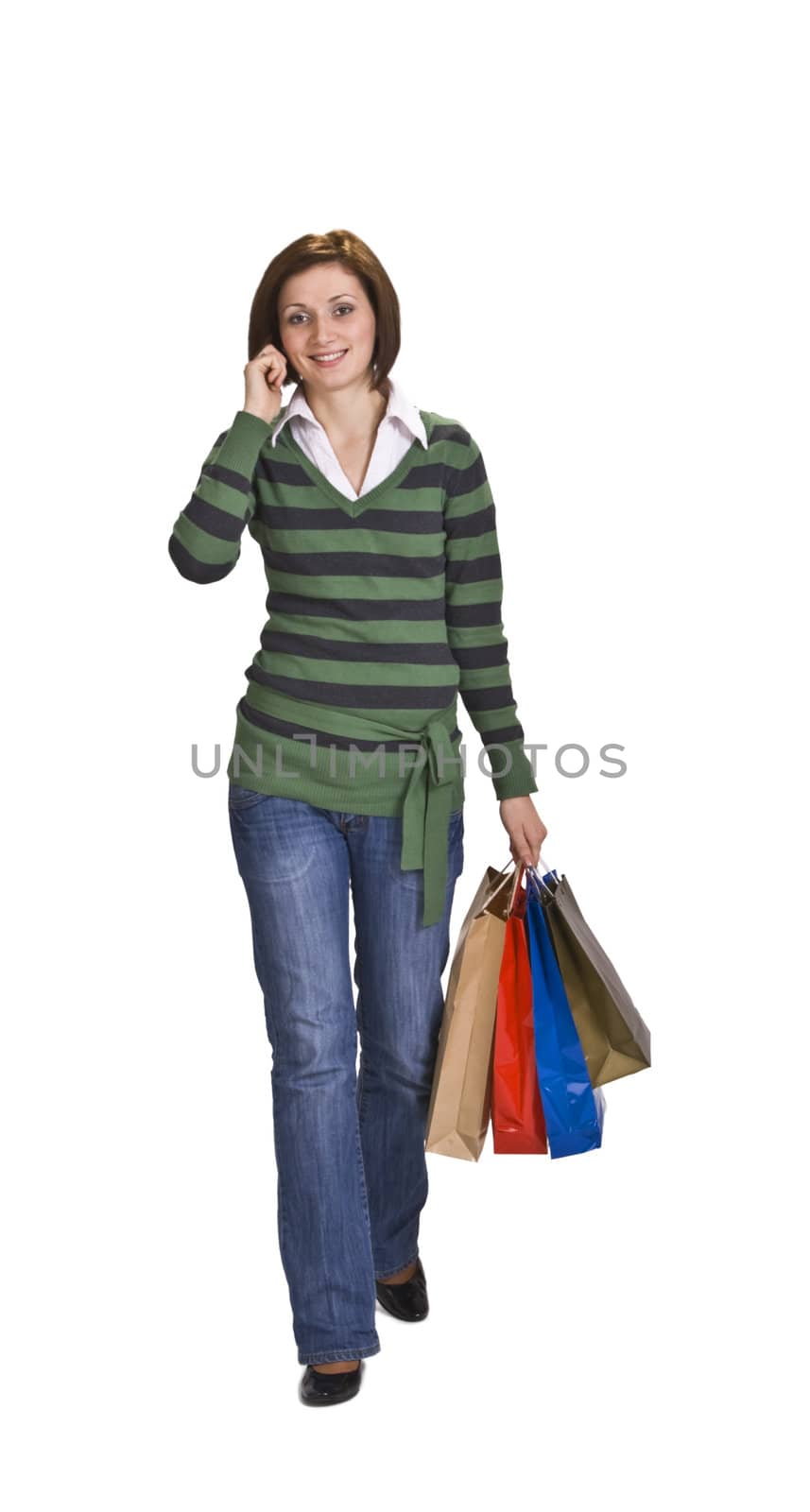 Young woman with shopping bags using a mobile phone.
