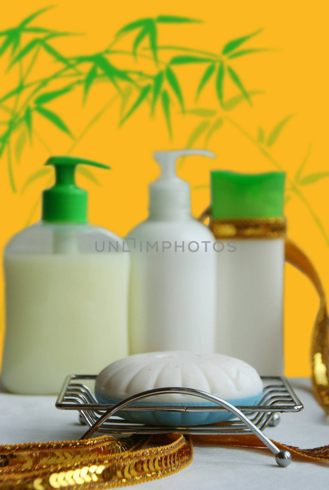 Soap in a soap tray and a set of bottles from cosmetics