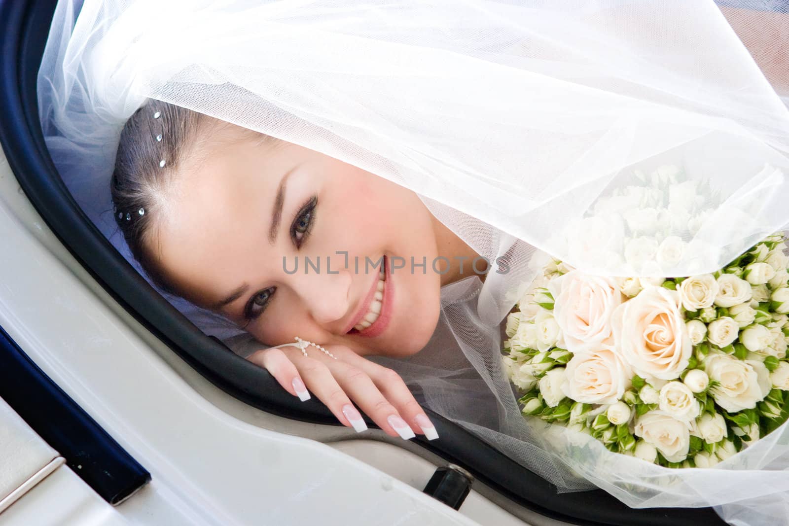 bride looks out of the car