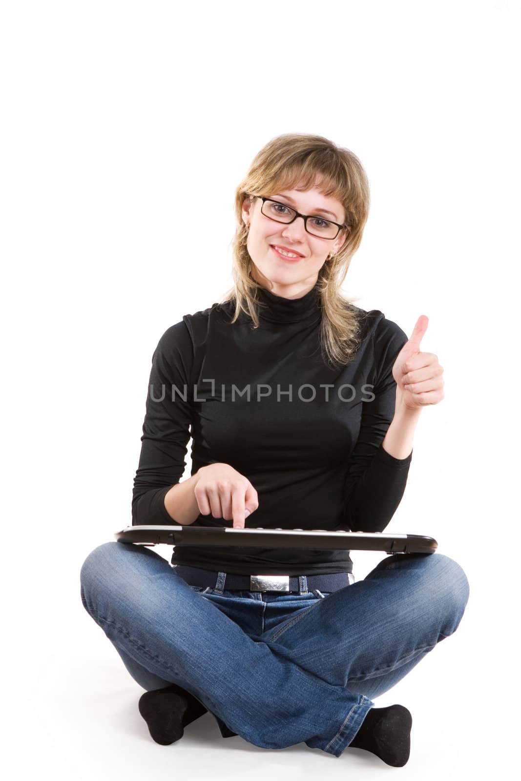 a smiling girl with a keyboard shows that everything is good
 