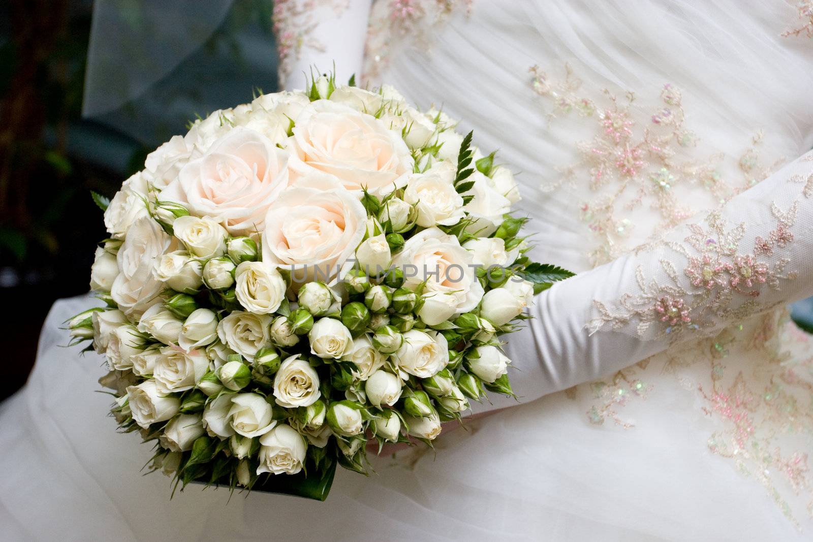 bride, wedding dress and flower bouquet