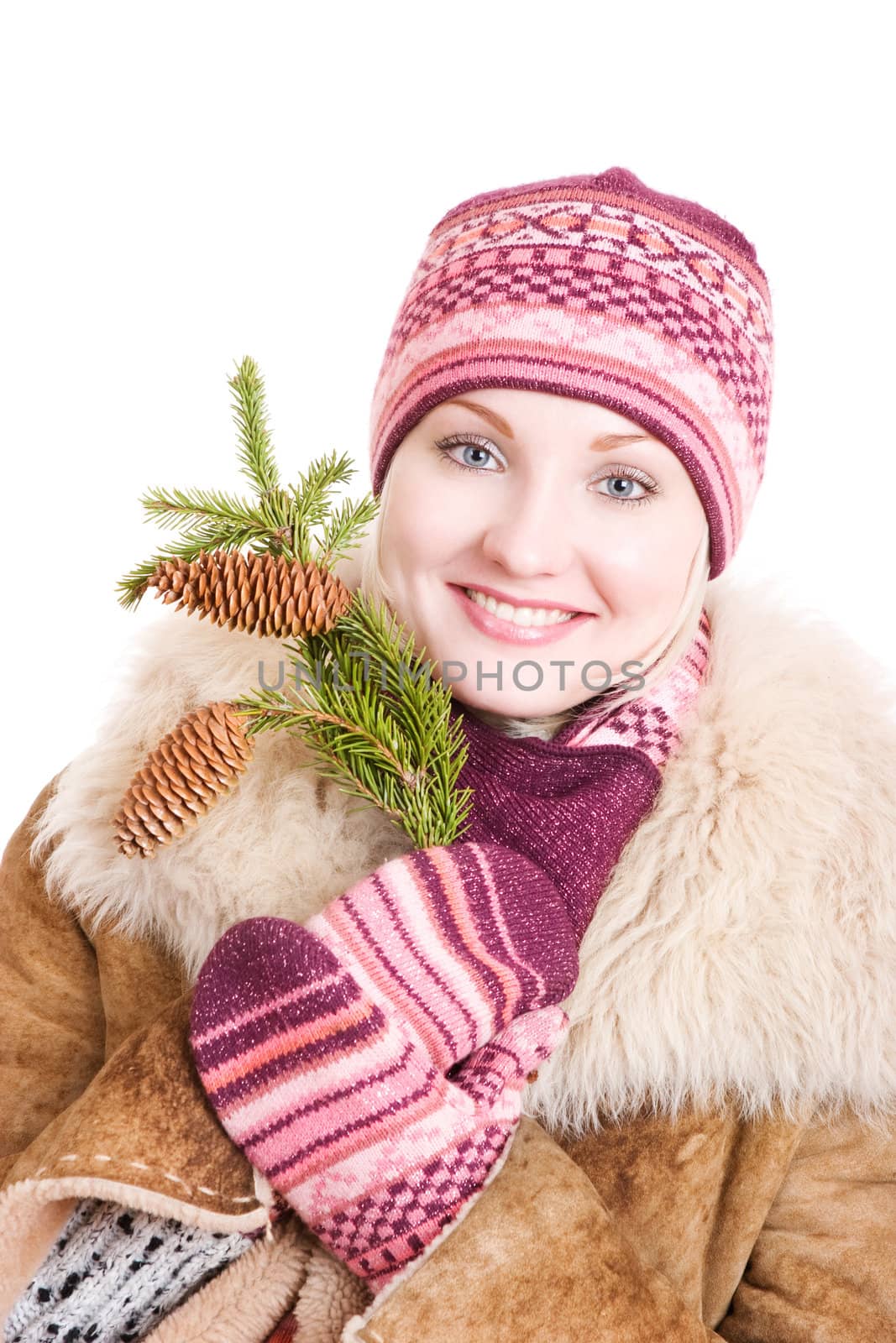 young happy woman with a branch of fur tree with cones