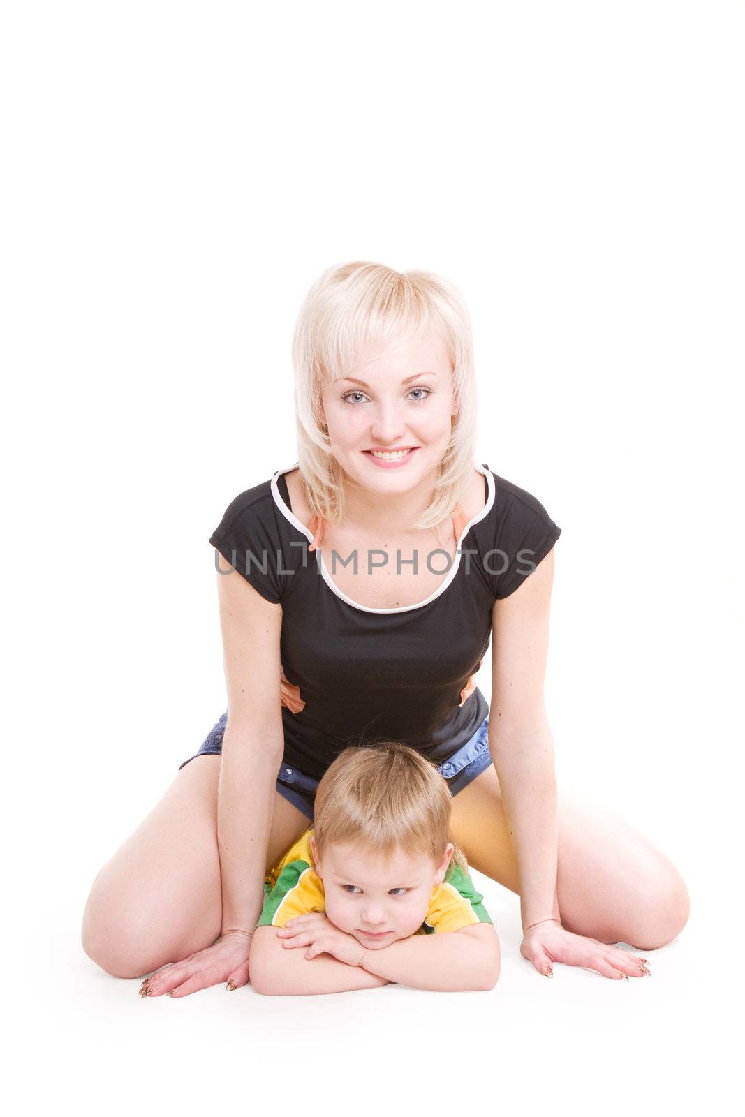 smiling young mother and her little son on the floor by vsurkov